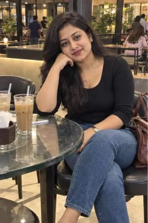 Aanya, 24, call girl in Navi Mumbai, Mumbai: at a Vashi cafe in a black top and jeans with a cold coffee