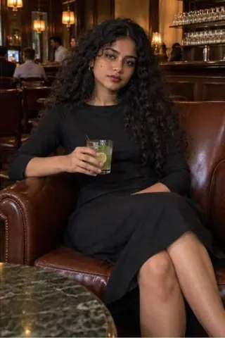 Amyra, 24, call girl in Colaba, Mumbai: in a hotel bar in a black dress with a lime drink