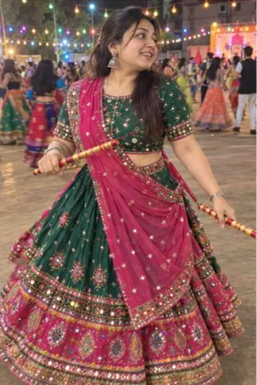 Ananya, 27, call girl in Goregaon, Mumbai: at a garba night in a green and pink chaniya choli with dandiya sticks