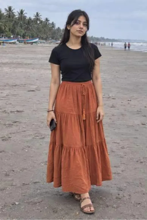 Jagriti, 24, call girl in Borivali, Mumbai: on Gorai beach in a black tee and a long rust skirt