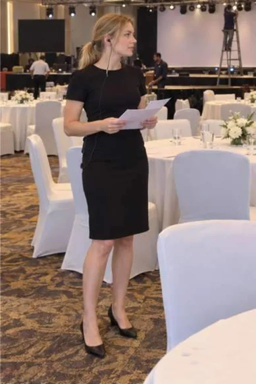Olesya, 27, call girl in Juhu, Mumbai: setting up a hotel banquet hall in a plain black dress